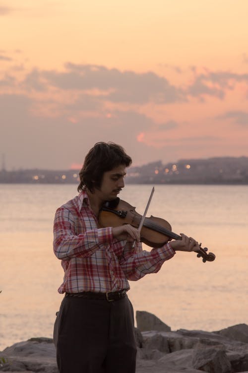Man in Plaid Shirt Playing Violin