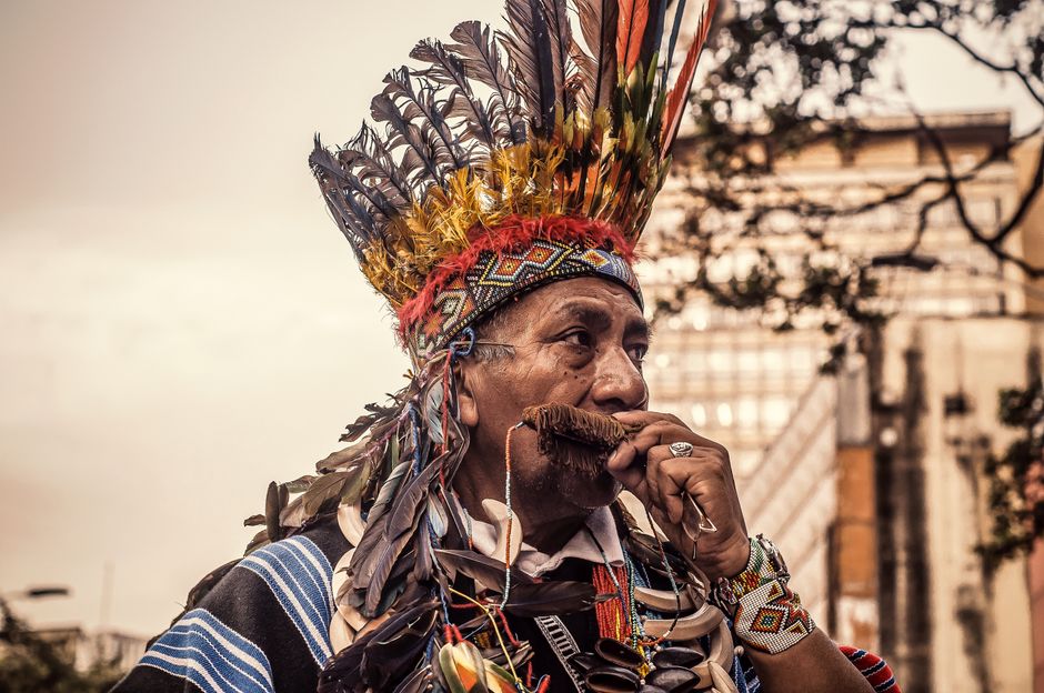 Indigenous people sharing traditional crafts and cultural knowledge with respectful visitors