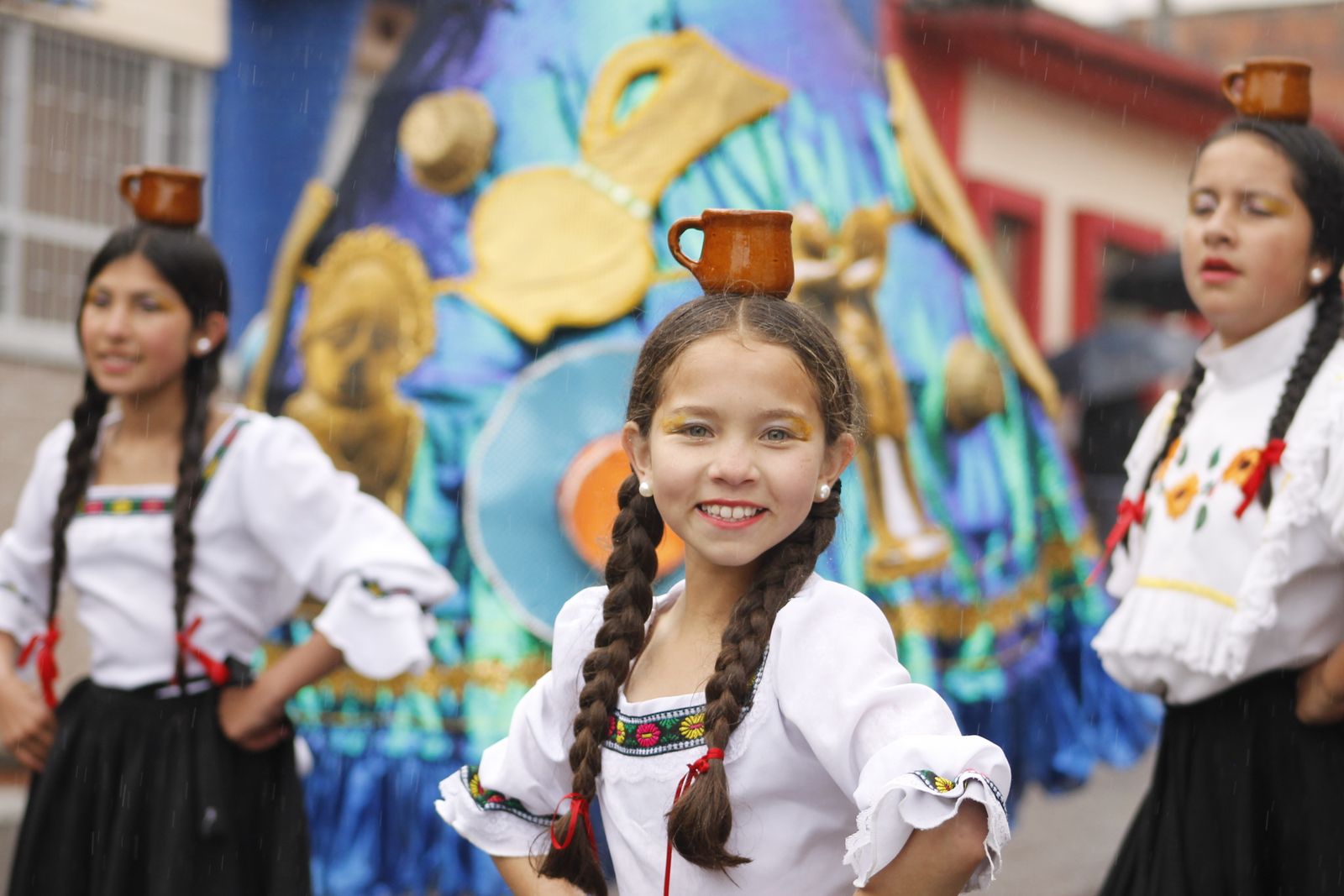 Dancer demonstrating the forward-and-back rocking step of cumbia