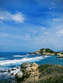 Explore the breathtaking rocky shoreline of Taganga, Magdalena. Perfect seascape for nature enthusiasts.