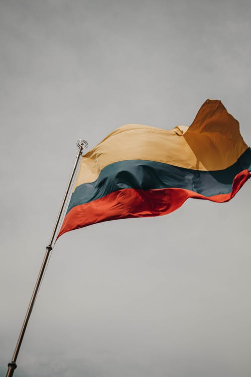 Lithuanian Flag under Clouds