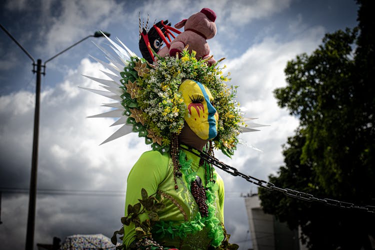 Person Wearing A Festival Costume Walking With A Chain