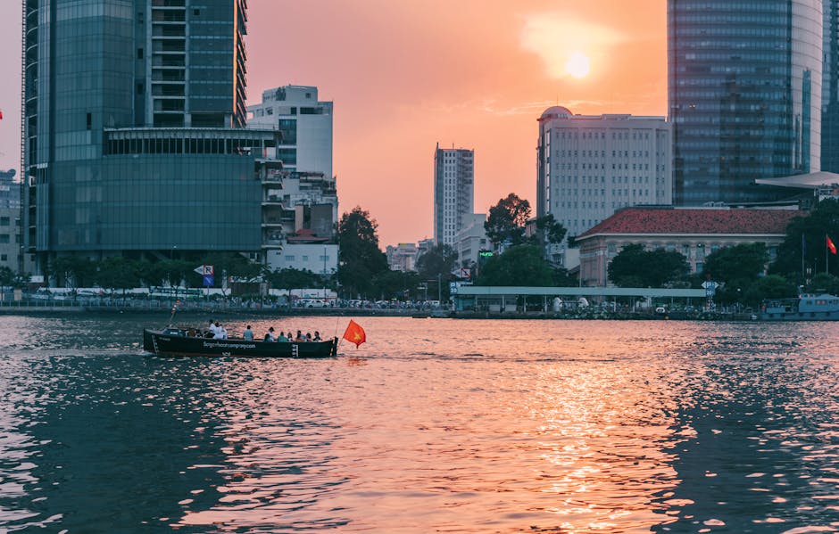 People Riding on Boat Sailing Along Calm Waters