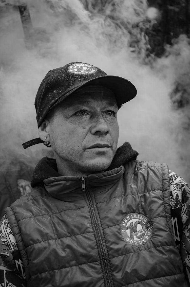 Grayscale Photo Of Man Wearing Black Snapback