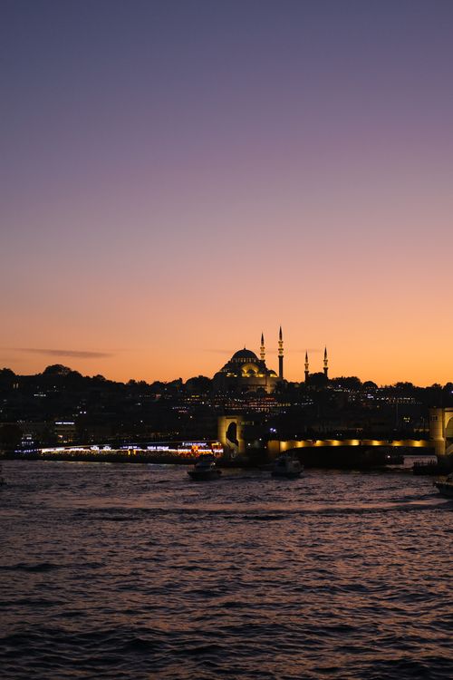 Free Stunning view of Istanbul skyline with mosque silhouette during sunset over the Bosphorus. Stock Photo