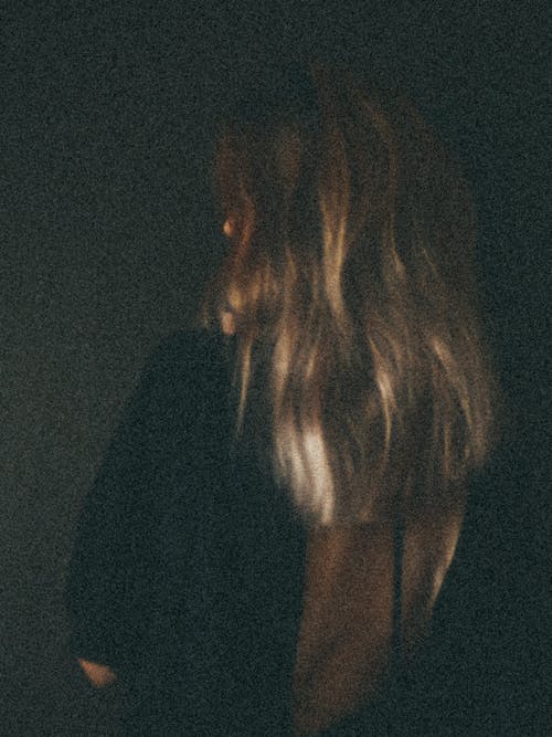 Dark Abstract Photograph of a Woman with Blond Hair
