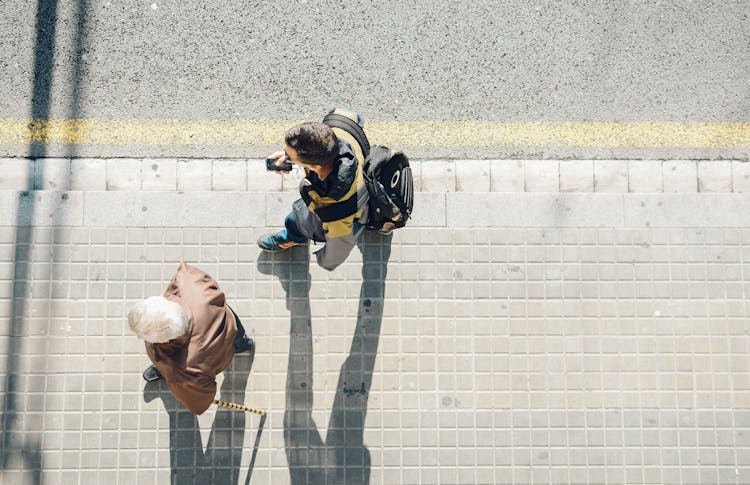 High-angle Photography Of Two Person Walking Beside Road