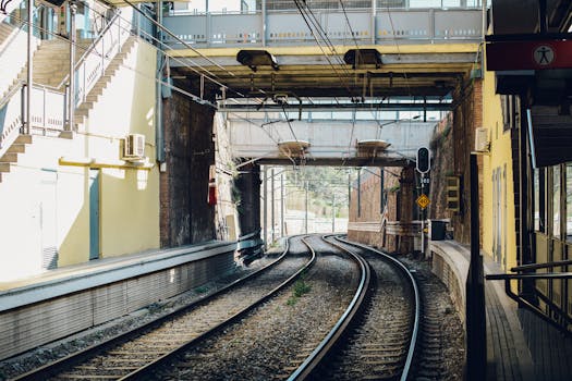 A modern train station in Barcelona captures urban transportation with sunlight and architecture.