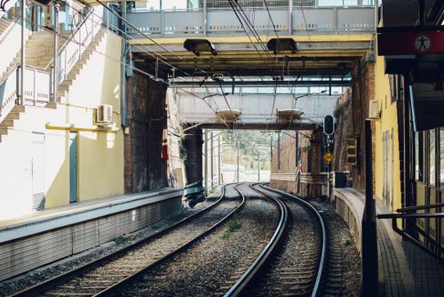 Free A modern train station in Barcelona captures urban transportation with sunlight and architecture. Stock Photo