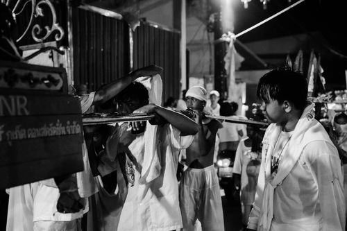 Free Participants in a religious ceremony during the Phuket Vegetarian Festival at night. Stock Photo