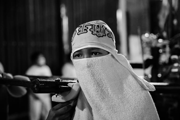 Person With Face Covered With Towel