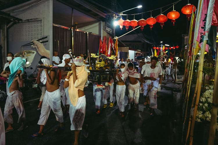 People Carrying Throne At Night