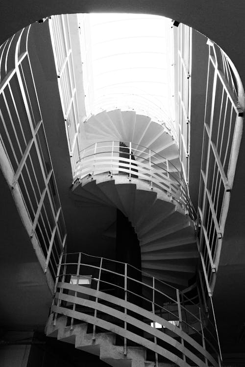 Grayscale Photo of Spiral Staircase