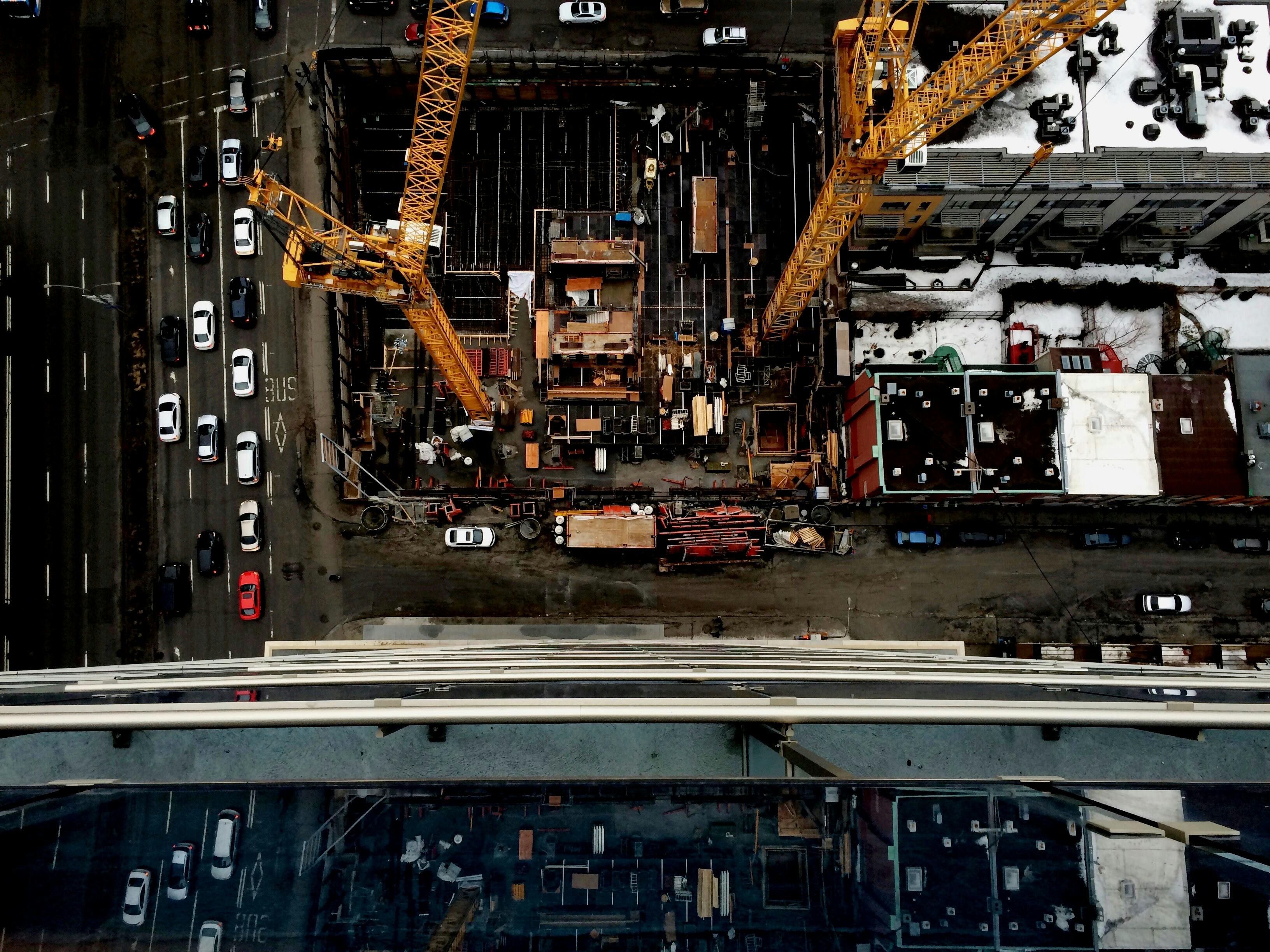 aerial view photography of crane towers