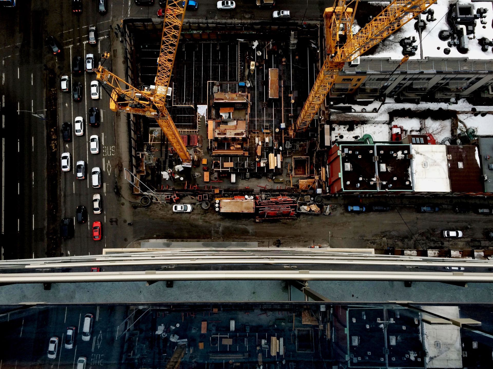 Aerial view of an urban construction site with cranes