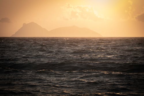 Body of Water Near Mountain