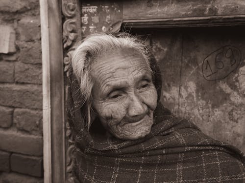 Grayscale Photo of an Elderly Woman