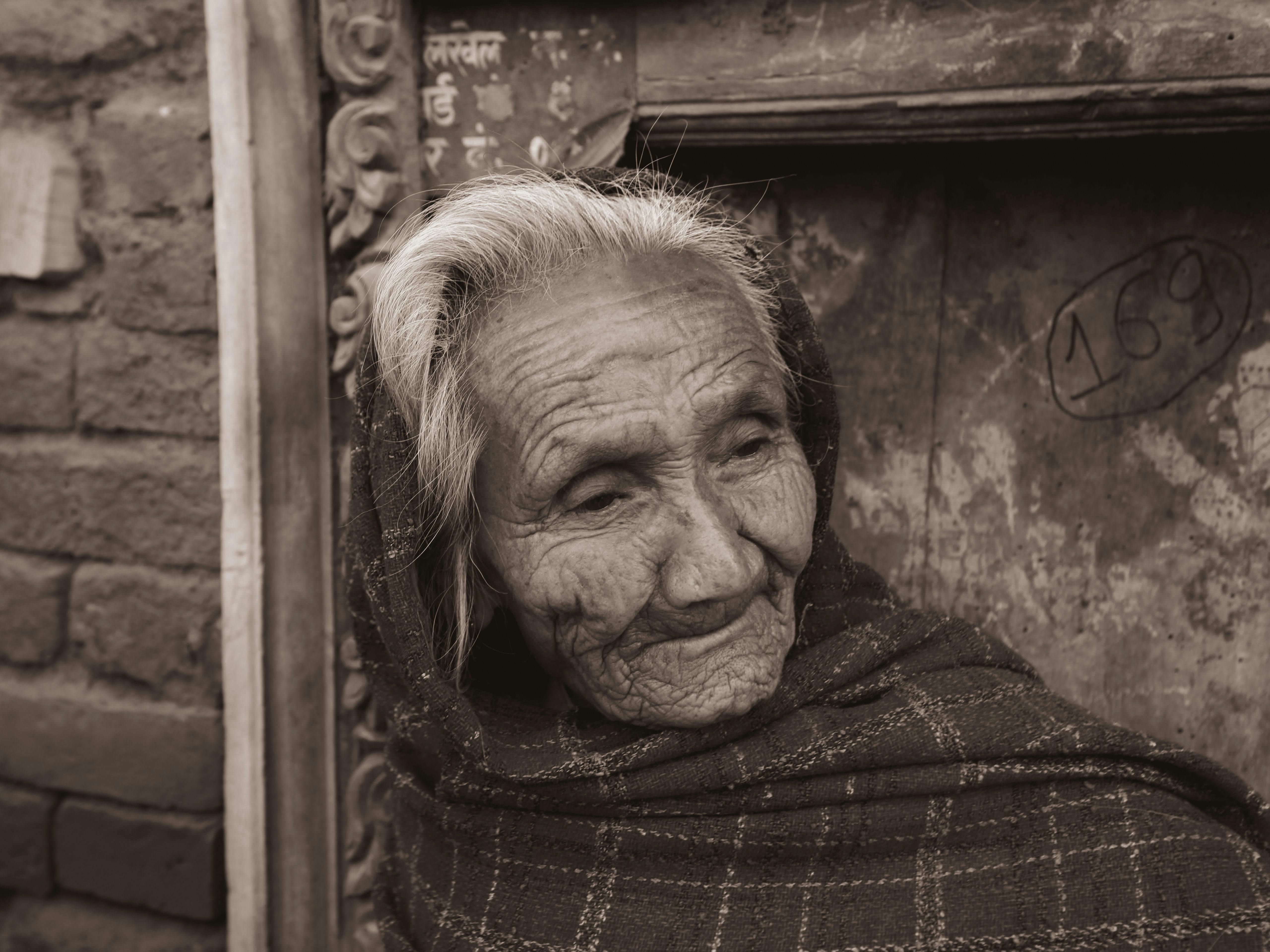 Black And White Photo Of A Man Holding The Hand Of An Elderly Woman On A Wheelchair · Free Stock 7502