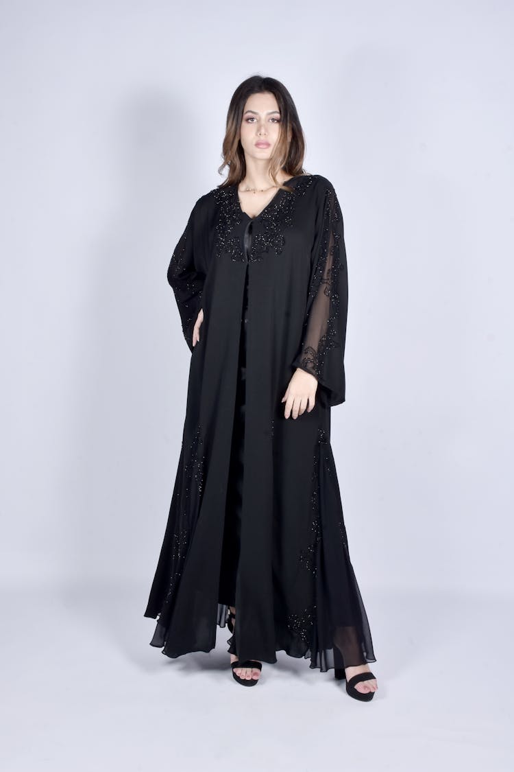 Woman Wearing A Black Abaya And High Heels