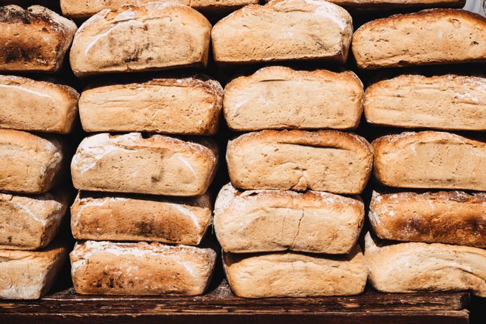 Rustic bread loaves cooling on a rack — photo by freestocks.org on Pexels