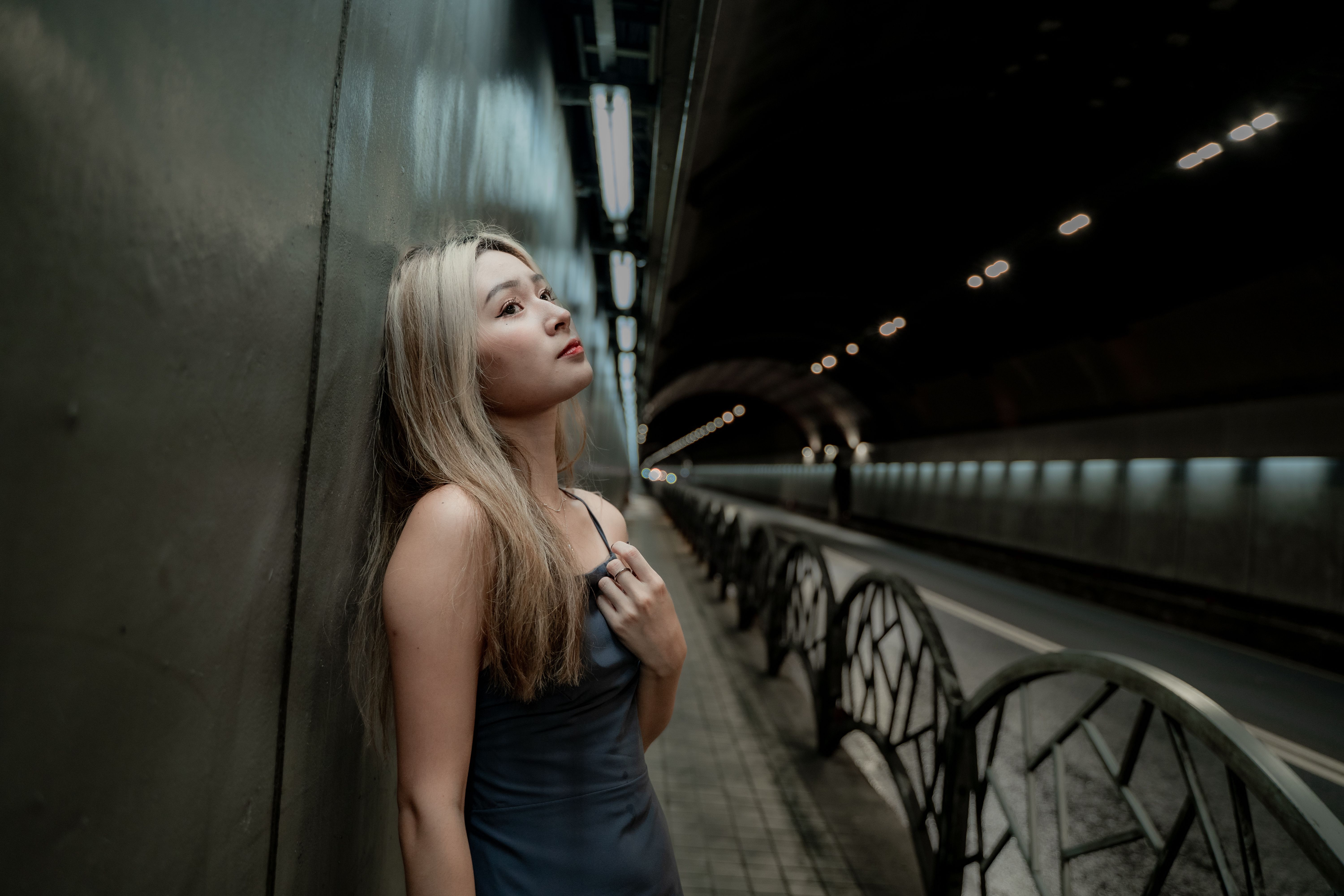 Woman in White Long Sleeve Dress Standing on Stairs · Free Stock Photo