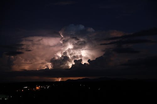 Dramatic Sky with Clouds and a Thunderstorm at Night