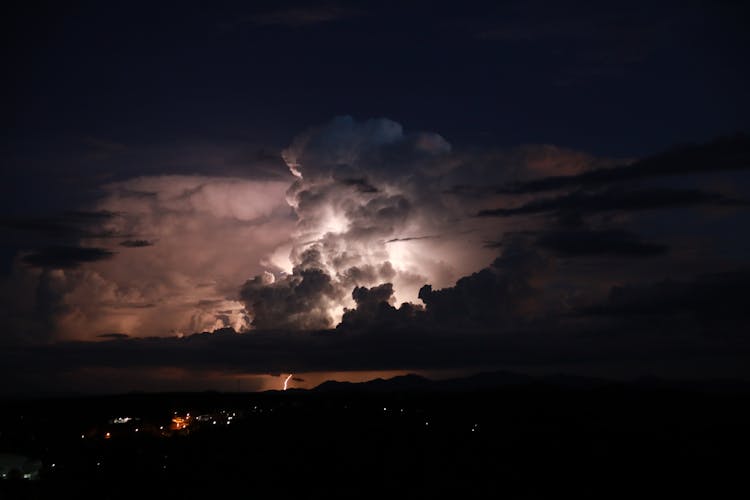 Dramatic Sky With Clouds And A Thunderstorm At Night