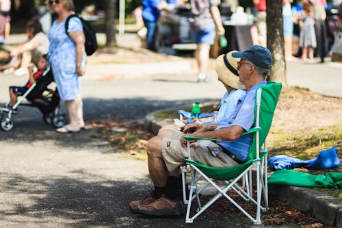 Man Sitting on Green Chair