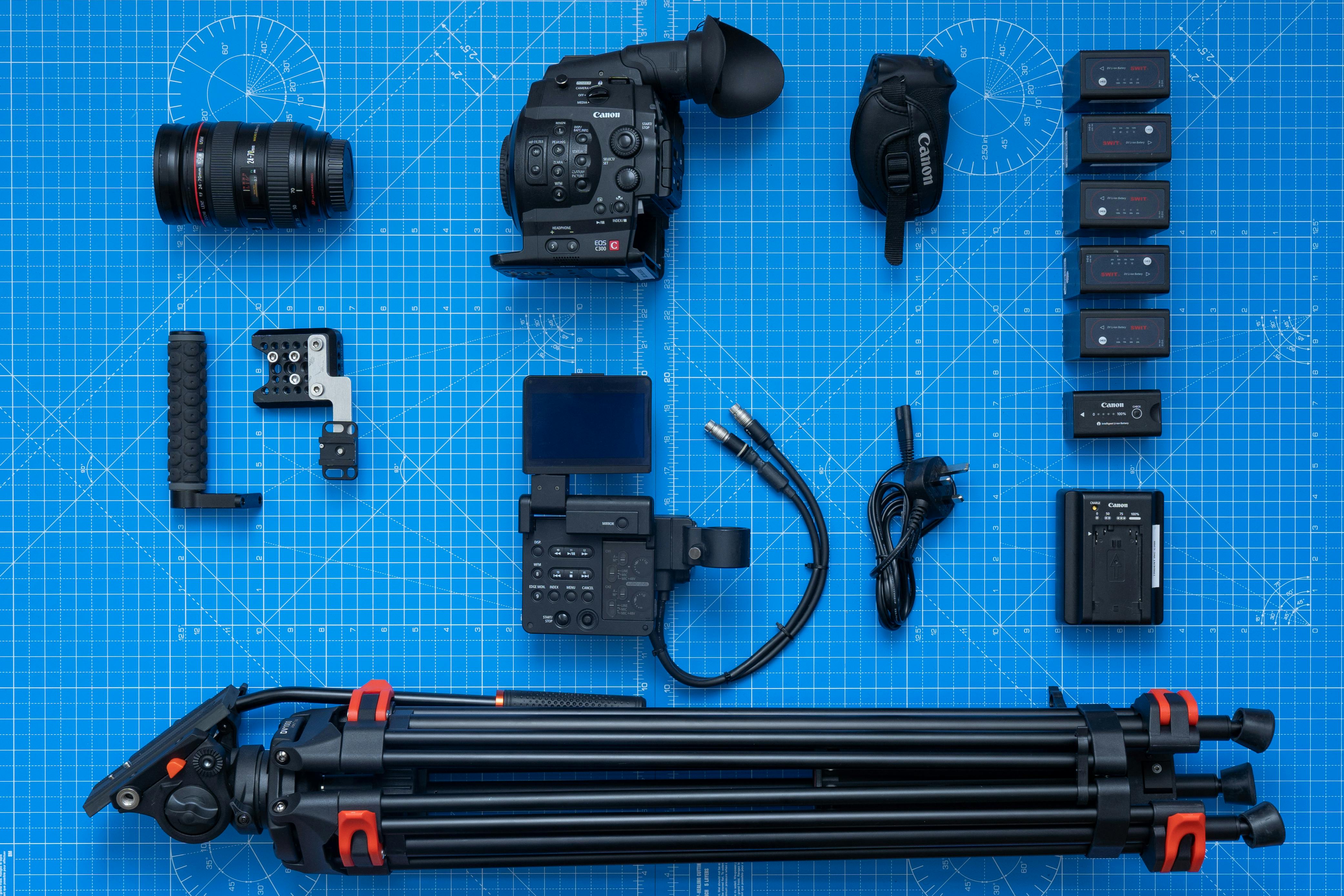 variety of camera equipment on graphing board