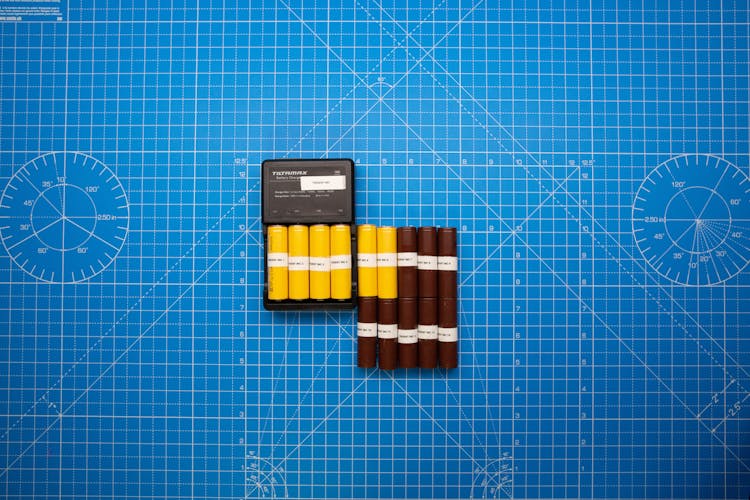 A Set Of Yellow And Brown Batteries