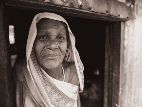Free Monochrome portrait of an elderly woman with traditional attire and jewelry. Stock Photo
