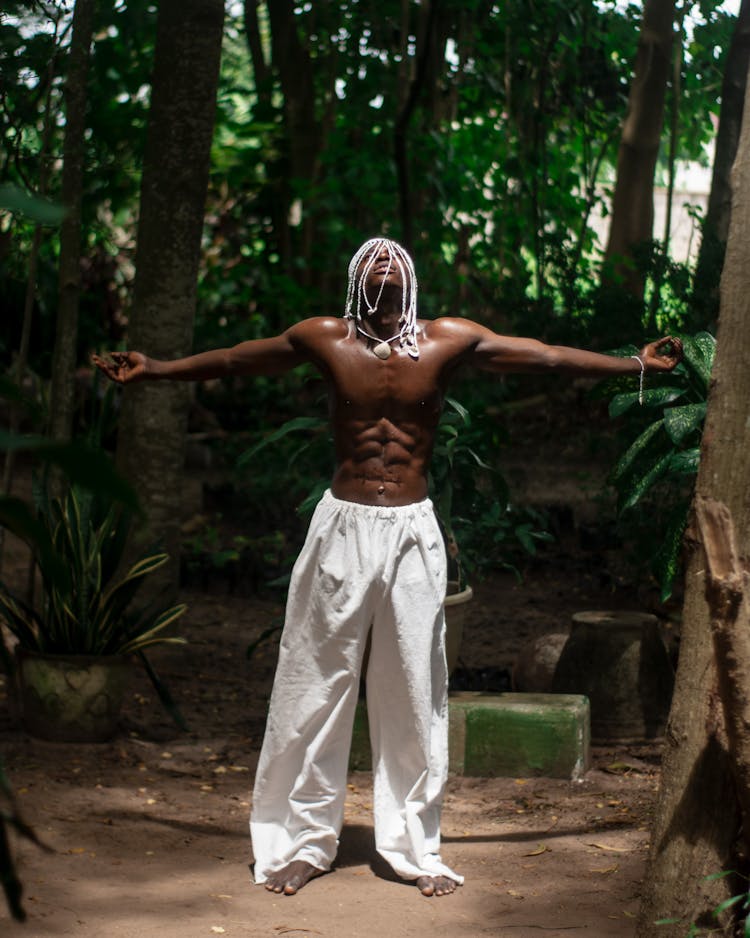 Muscular Shirtless Man Posing In Forest