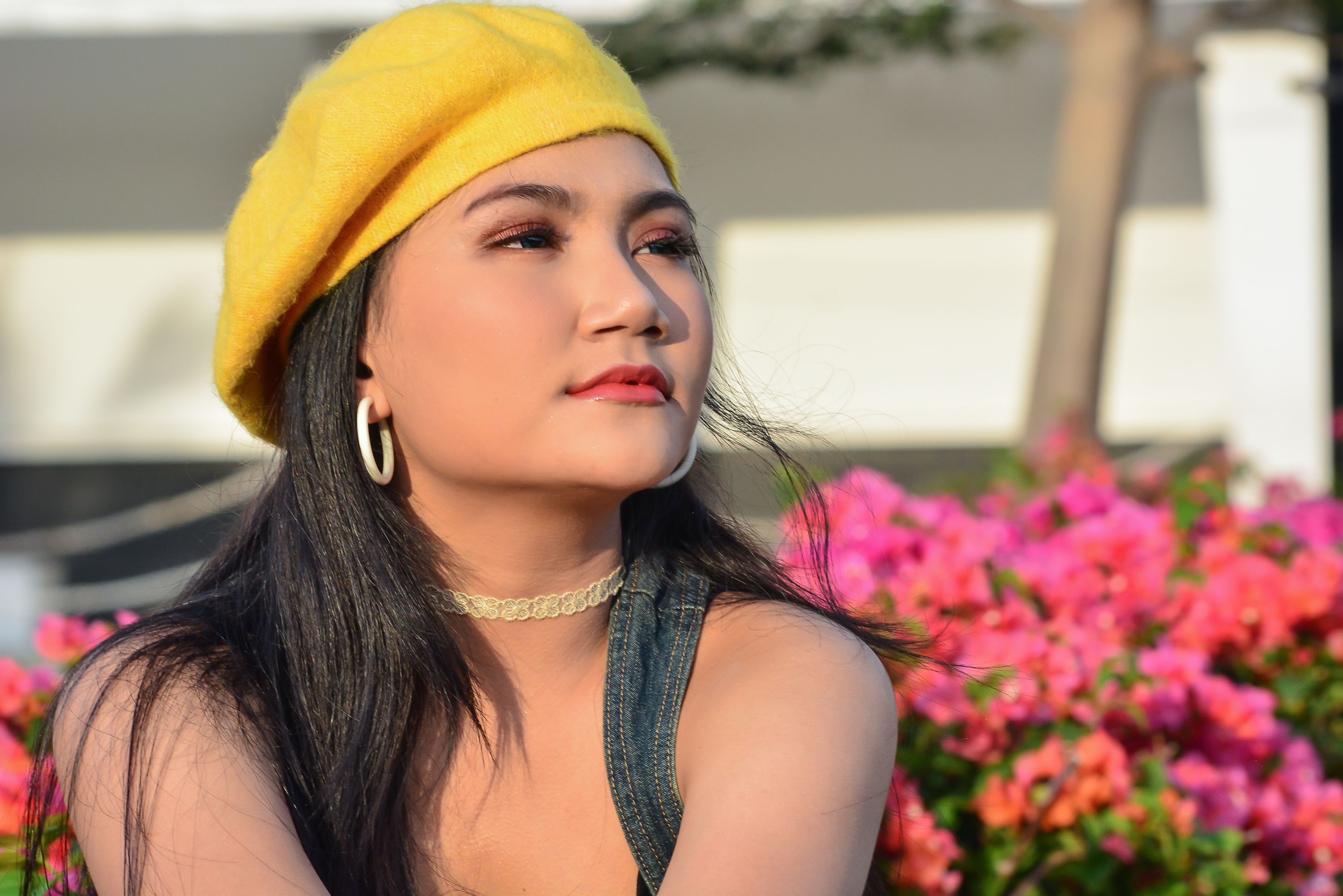 A Woman Wearing a Yellow Hat · Free Stock Photo