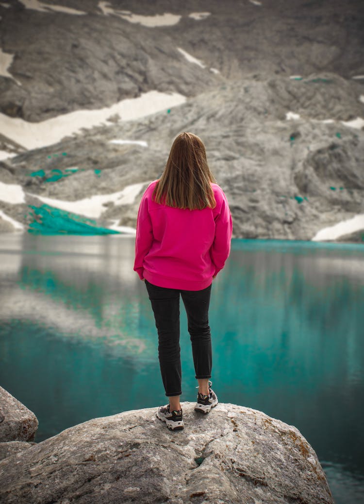 Woman Standing On A Rock