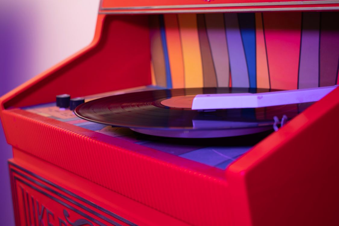 Vinyl Record on a Colorful Record Player · Free Stock Photo