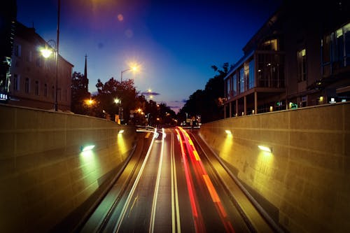 Timelapse Photography of Road Between Houses