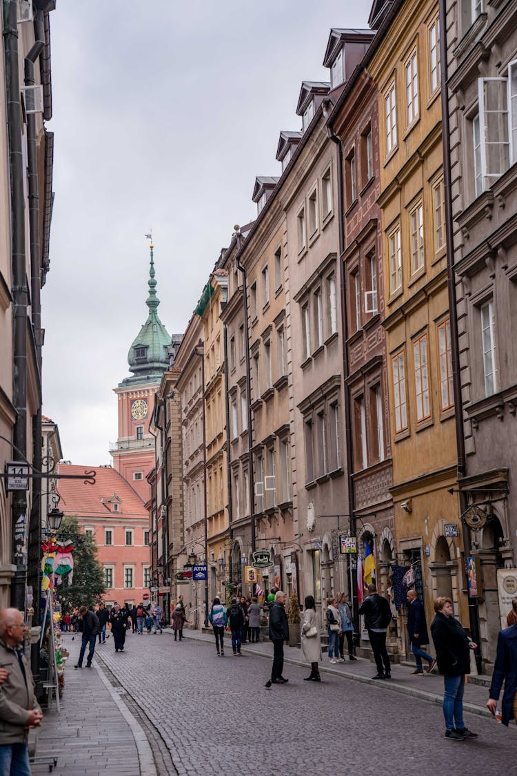 People On Old City Street With Historic Buildings