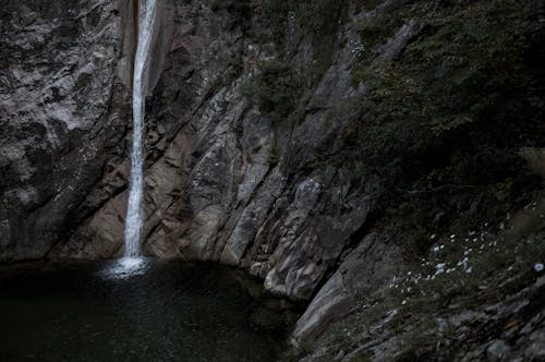 Photo of Waterfalls on Rocky Cliff