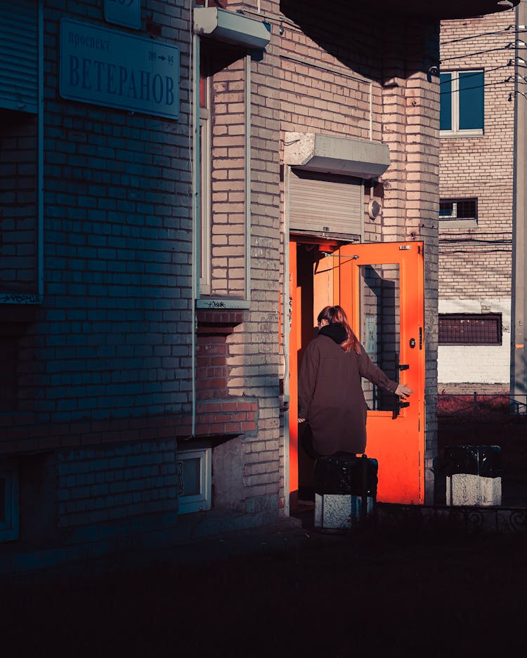 Woman Entering Apartment Building