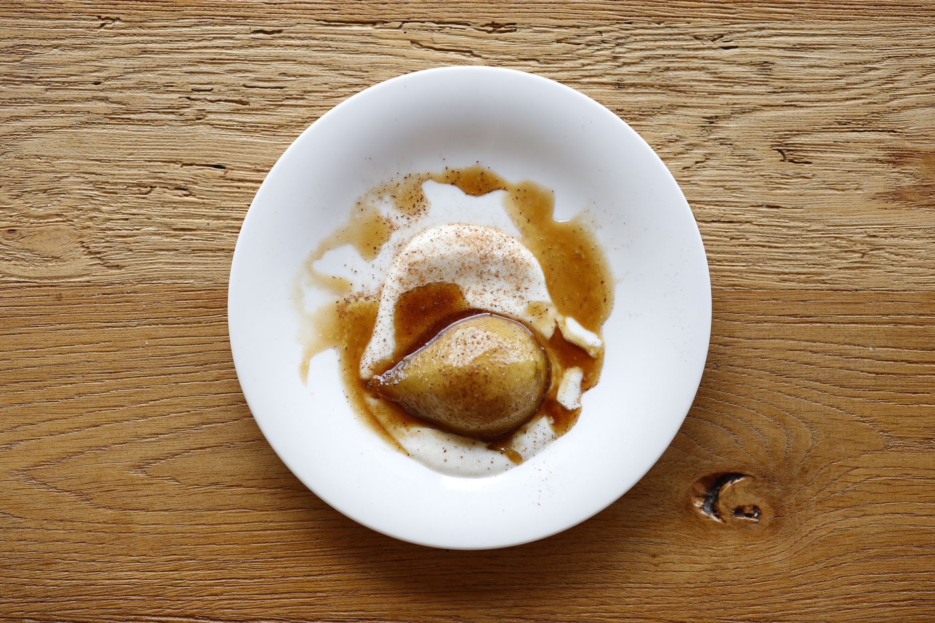 Poached apples in vanilla cinnamon syrup served in bowls