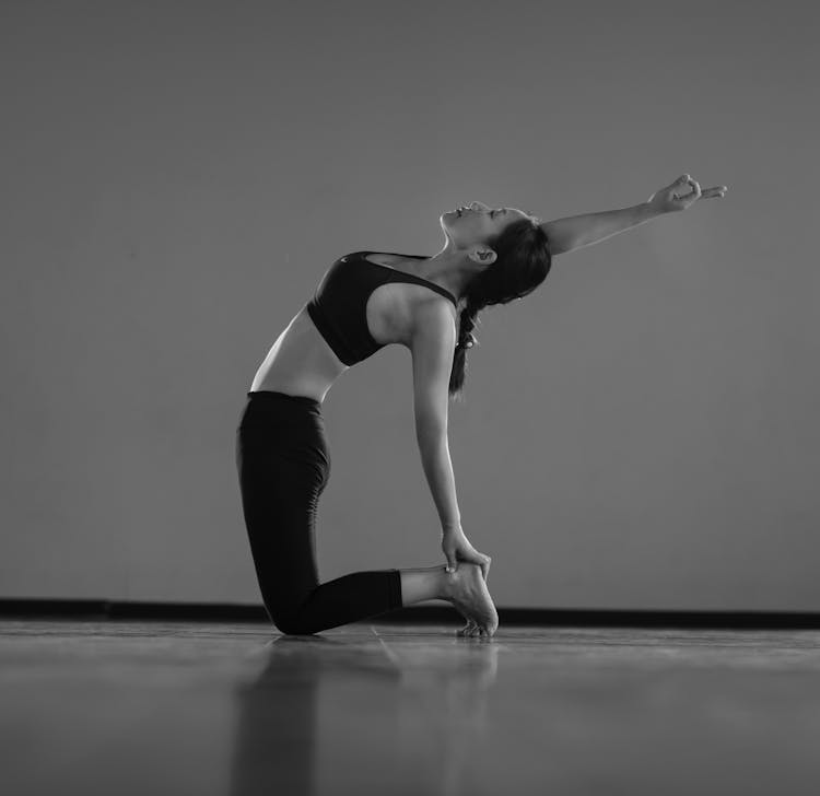 A Woman Doing Yoga In A Room