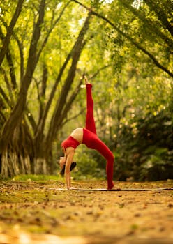 Pregnant woman stretching in a forest setting promoting wellness and mindfulness.