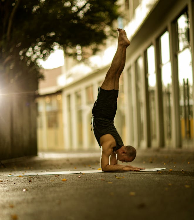 Man in Yoga Figure with Legs Raised · Free Stock Photo