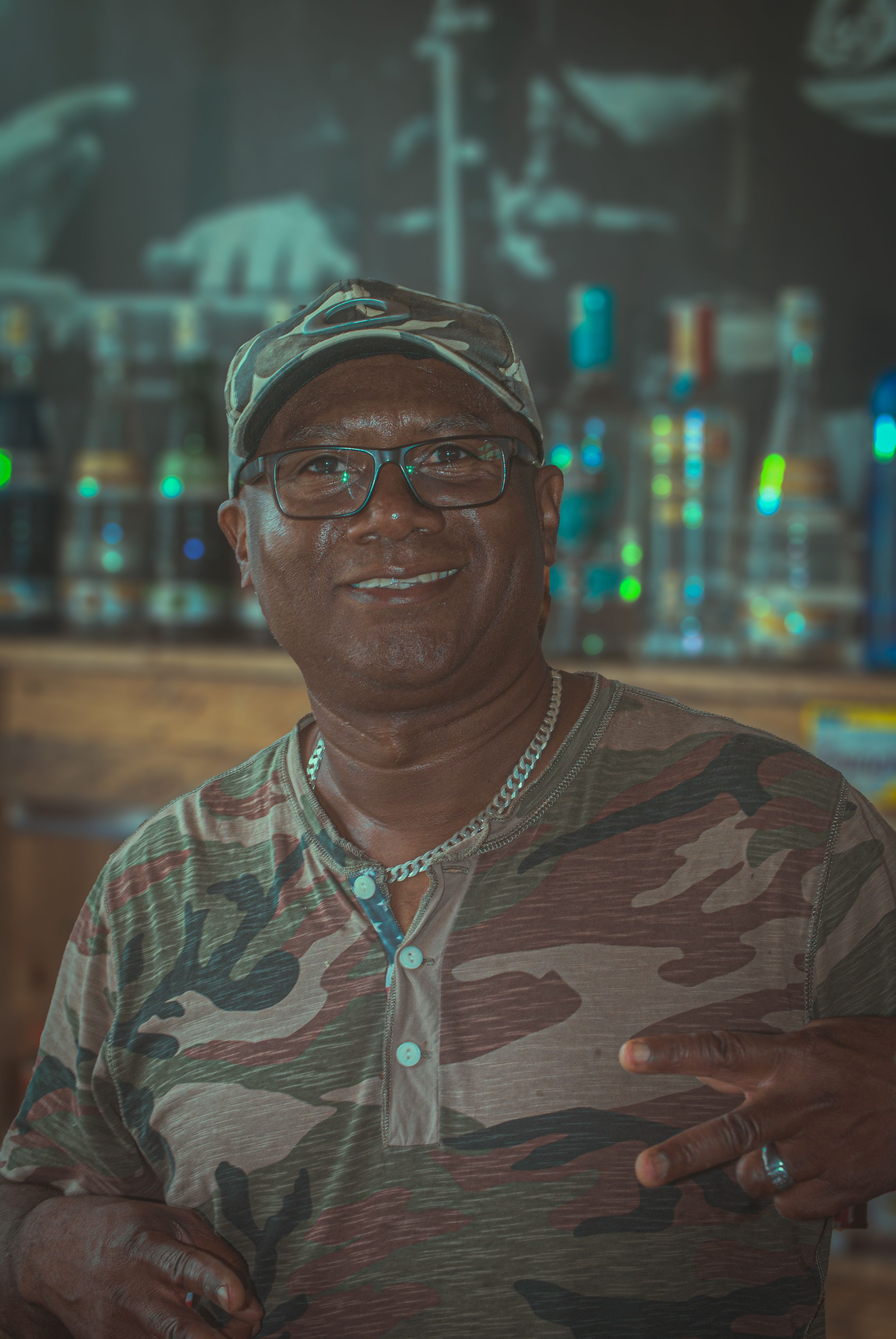 A Man Wearing Camouflage Shirt and Hat · Free Stock Photo