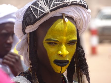 Person with Yellow and Brown Face Painting