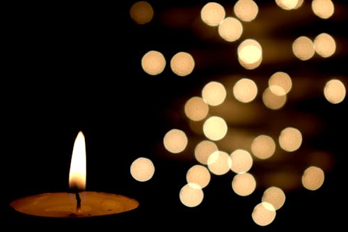 Lighted Candle on Bokeh Photography 