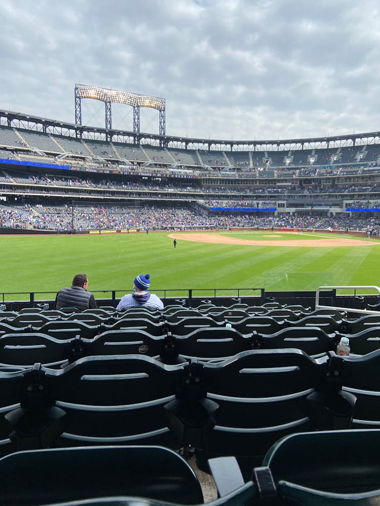 Men Sitting Inside Empty Stadium