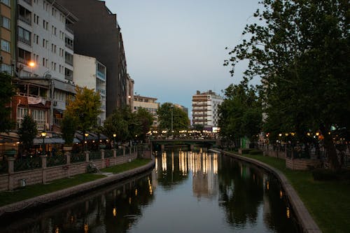 Riverbanks in Town in Evening