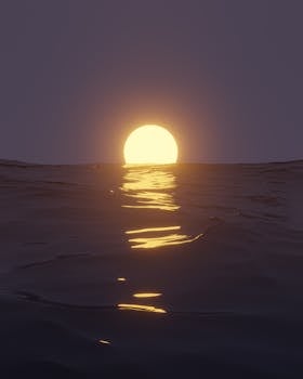 Serene sunset over the ocean with beautiful reflections on calm waters.