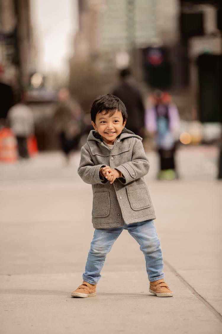 Smiling Boy In Coat